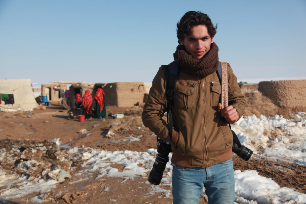 Farshad Usyan with his camera in Afghanistan. (Photo by Bahar Mohamadian)