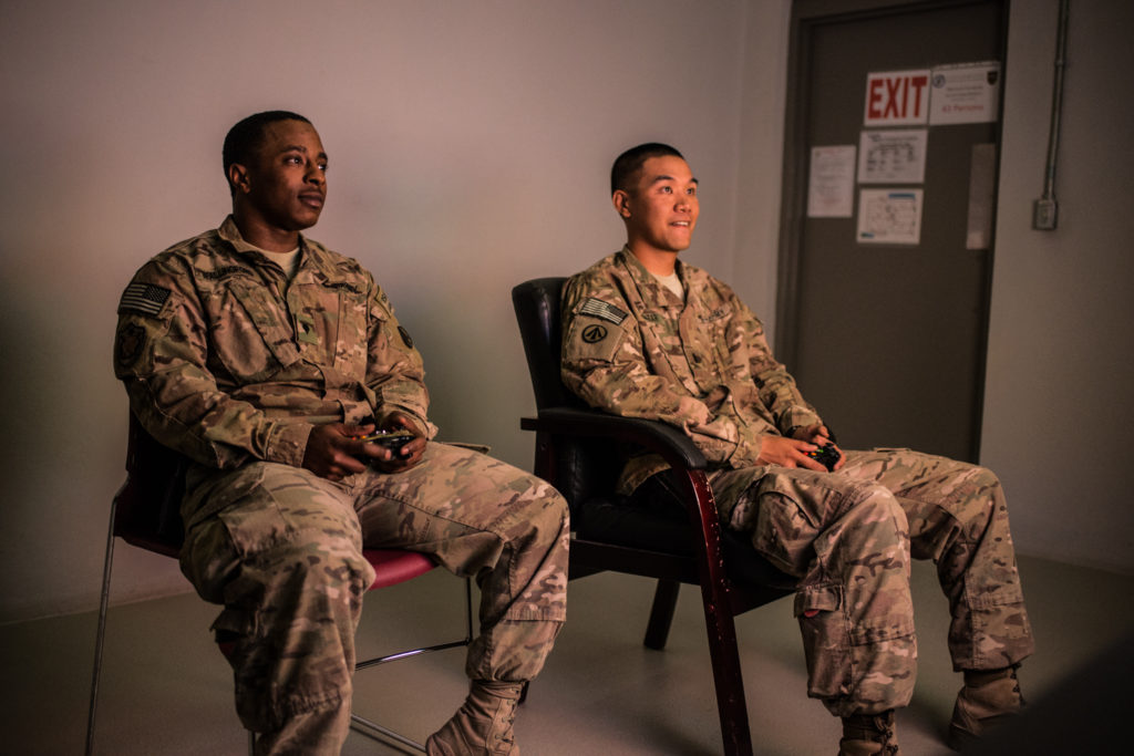 Soldiers play video games in Bagram Airfield's new recreation center. (Photo by Ben Brody)