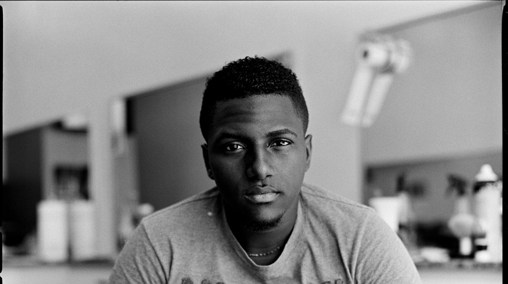 Alberto Ramon, 20, came to Puerto Rico from the Dominican Republic to join his father and found work as a barber. He plans to move to the United States as soon as he gets the opportunity. "It's better to go somewhere else than here," he says. "There's nothing. If customers used to come weekly, now they come monthly...Hopefully this year, God willing, I am going to the U.S." (Edwin Torres/GroundTruth)