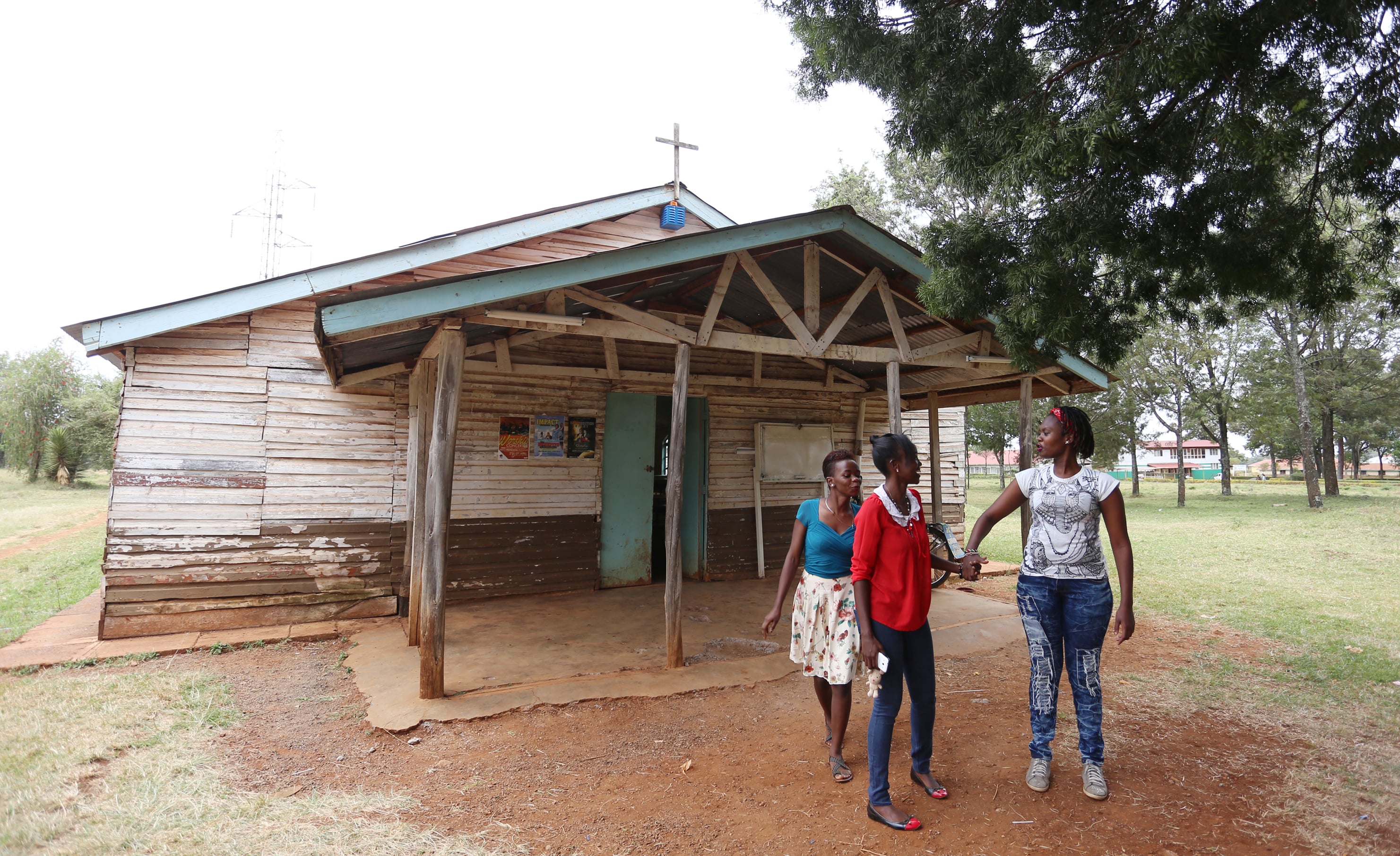 Maria Njeri (right), one of the Garissa University terror attack survivors who transferred to Moi University in Eldoret, is pictured with friends at Moi University Grace Chapel after an afternoon prayer fellowship on April 1, 2016. (Billy Mutai/GroundTruth)