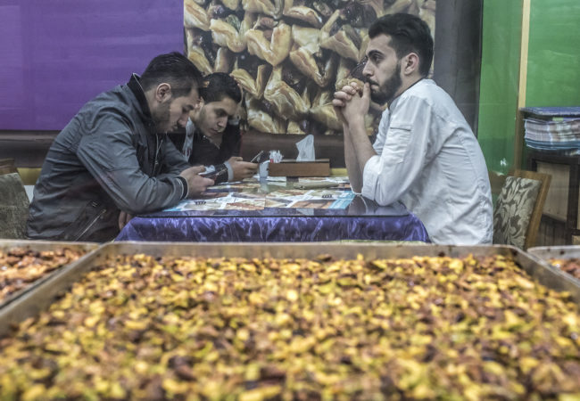 Customers eat at Salloura in Istanbul. (Photo by Joris van Gennip/GroundTruth)