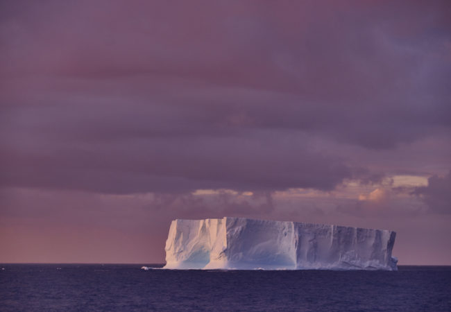 Tabular icebergs, recognizable by their cliff-like sides and flat tops, are typically taller than an apartment building and longer than a city block. (Photo by Oliver Wheeldon/2041 Foundation)