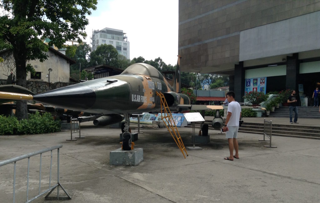 Downed U.S. military helicopters, fighter jets and tanks are on display in front of the War Remnants Museum in Ho Chi Minh City. (Photo by Joanne Silberner/GroundTruth)