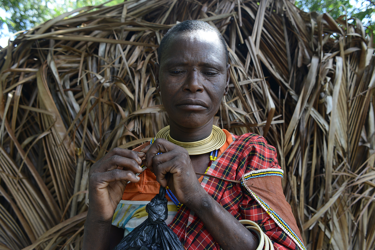 Udamugh, whose name means "waiting to heal," says that she was forced to settle in Mkombani four years ago when rangers from Mikumi National Park shot six of her cows, one by one, as she watched from inside her boma. "No words were exchanged," she says. "I was so upset. My family went to the district council to file a complaint, but no one investigated." (Photo by Dana Ullman/GroundTruth)