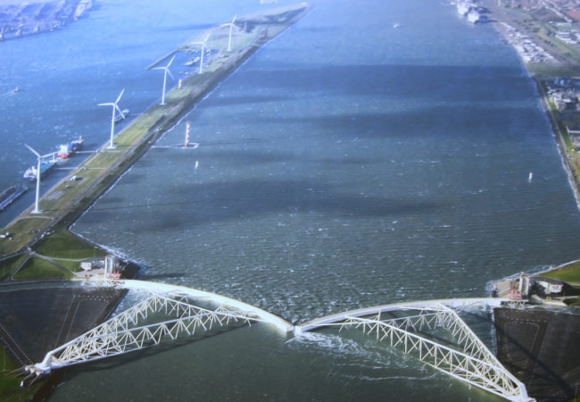 The largest mobile barrier in the world, the Maeslant storm surge barrier was built to protect the Dutch city of Rotterdam from a one-in-10,000-year storm. It's part of the massive investment the Dutch are making to protect themselves in a new era of rising sea levels. (Photo by Bert Knottenbeld/Flickr Creative Commons)