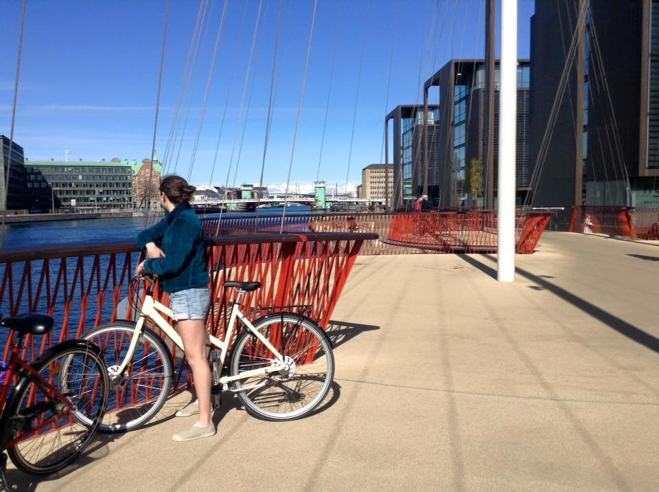 Weiner stands on a bike-only bridge in Copenhagen, Denmark. (Photo by Charlotte Weiner/GroundTruth)