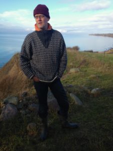 Nils Orum, who runs an organic farm on Aero, took up the fight when wind turbines were proposed for the land just north of his. He said that the land was protected, three times over; he won, and the wind turbines were eventually built elsewhere on the island. (Photo by Charlotte Weiner/GroundTruth)