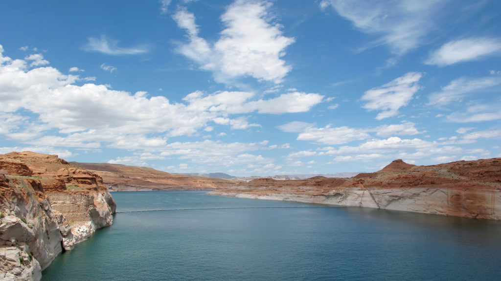 A nearly 100-foot high white-bleached “bathtub ring” marks where the water once rose at Lake Powell. (Photo by Charlotte Weiner/GroundTruth)