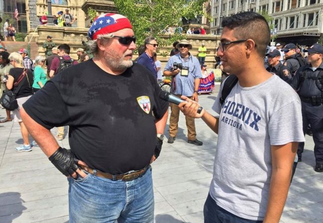 Mohamed Abdelfattah interviews Jack, a Trump supporter who rode from North Dakota to Cleveland for the RNC. (Photo by Jenny Montasir/GroundTruth)