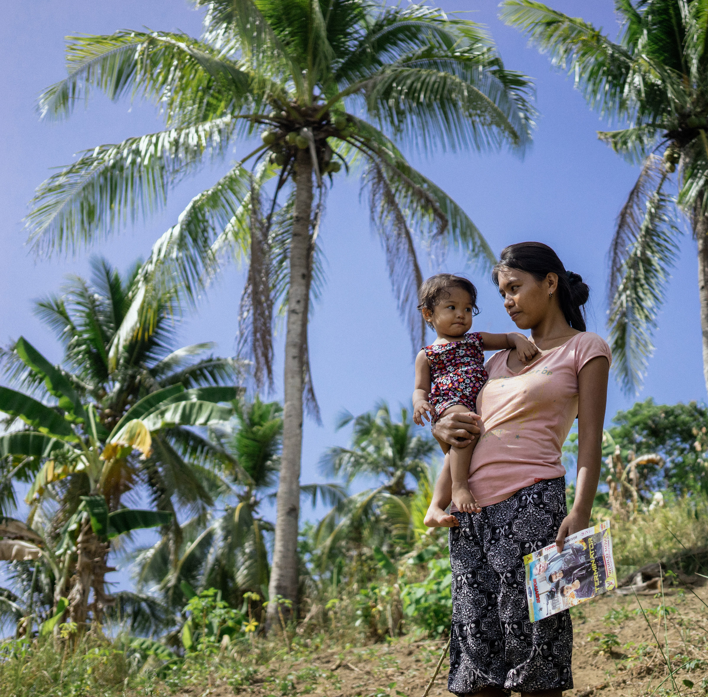 Tina was trafficked into a cyber sex den near Angeles when she was 16 and pregnant with her child. Her hometown, Daram, is one of the most vulnerable to climate change due to frequent storms and poverty. (Photo by Hannah Reyes/GroundTruth)