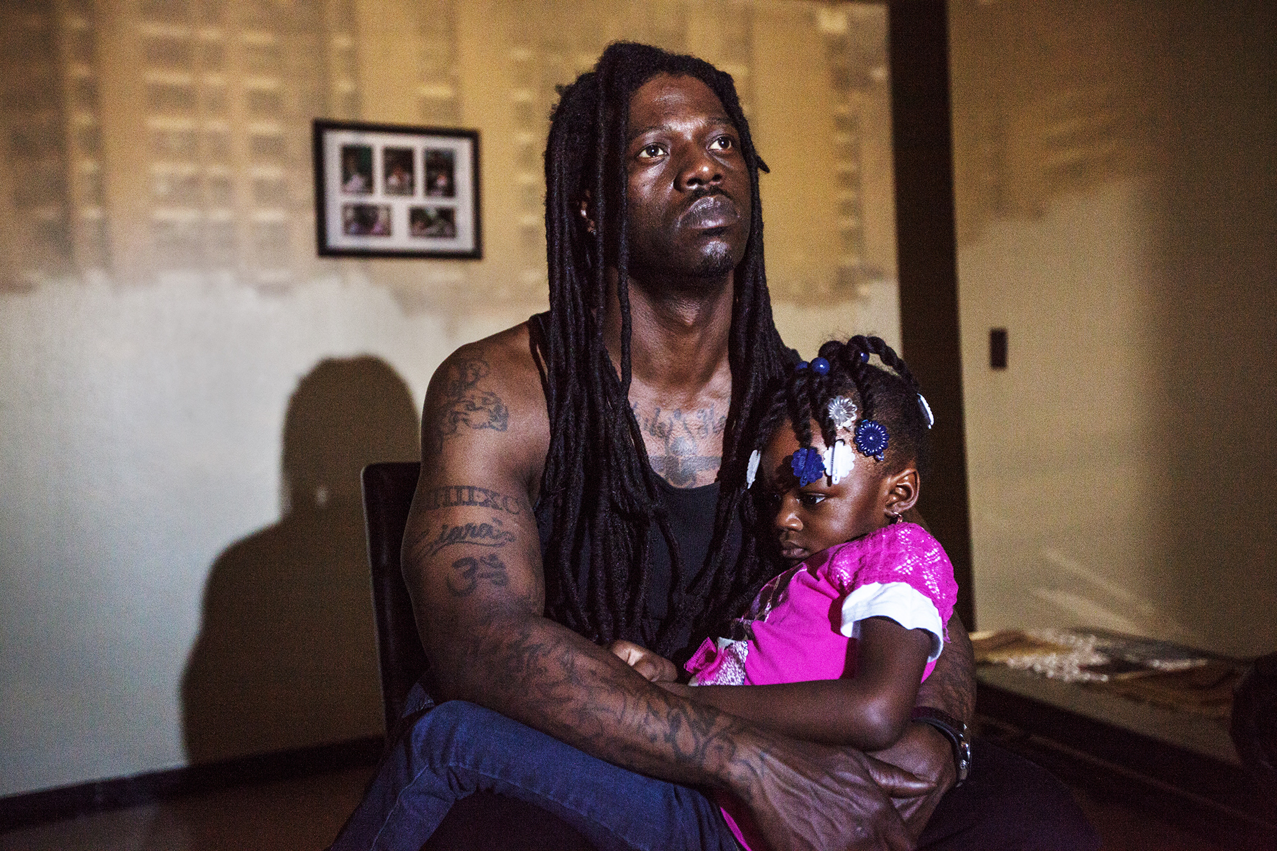 Raheem Grant, 39, poses for a portrait with his daughter, Nature Grant. “When I was growing up I didn’t have a father. My little one, she gets scared of the dark: ‘You don’t have to be scared because Daddy is here.’ Just knowing that I am there for them makes me feel like I accomplished a lot."
