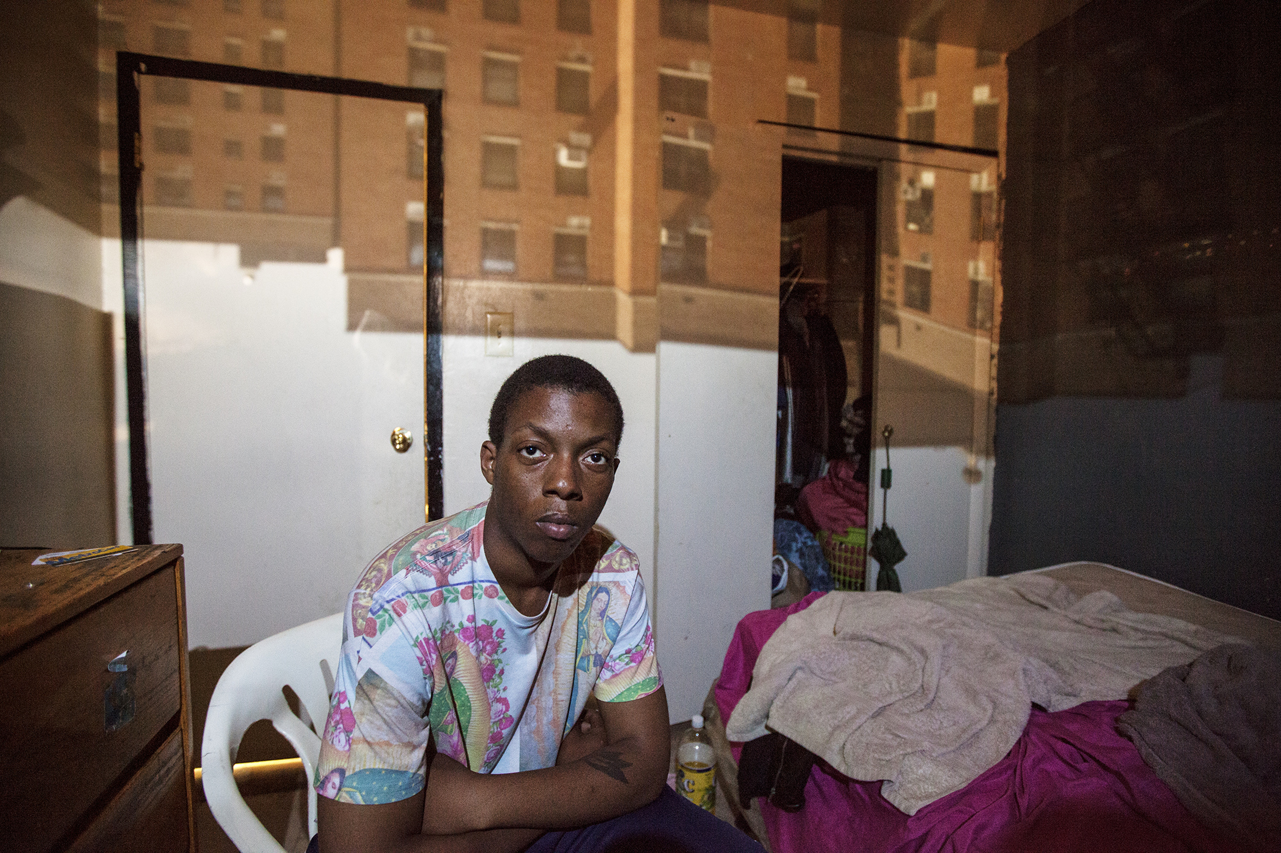 Esau "Chubbs" Johnson, 23, poses for a portrait in East New York, NY on May 30, 2015. "The cops are cracking down on us. You know, they are shooting kids. That's really what I am worried about: my daughter growing up in that environment."