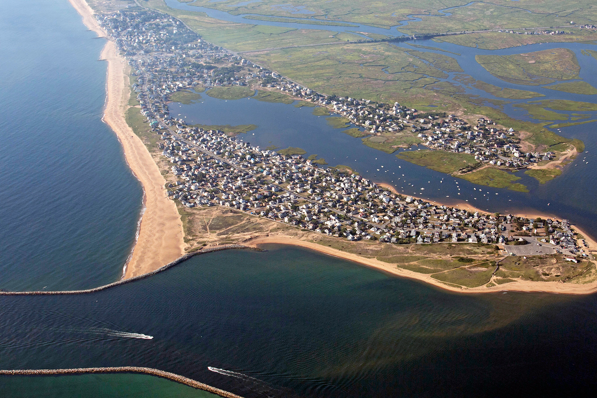 Across New England, coastal waters are rising due to climate change. Plum Island, on the North Shore of Massachusetts, is particularly vulnerable to major flooding from storm surges and beach erosion. “Don’t build here if you’re afraid of losing your house,” says longtime resident Verne Fisher. (Photo by Lauren Owens Lambert/GroundTruth) 