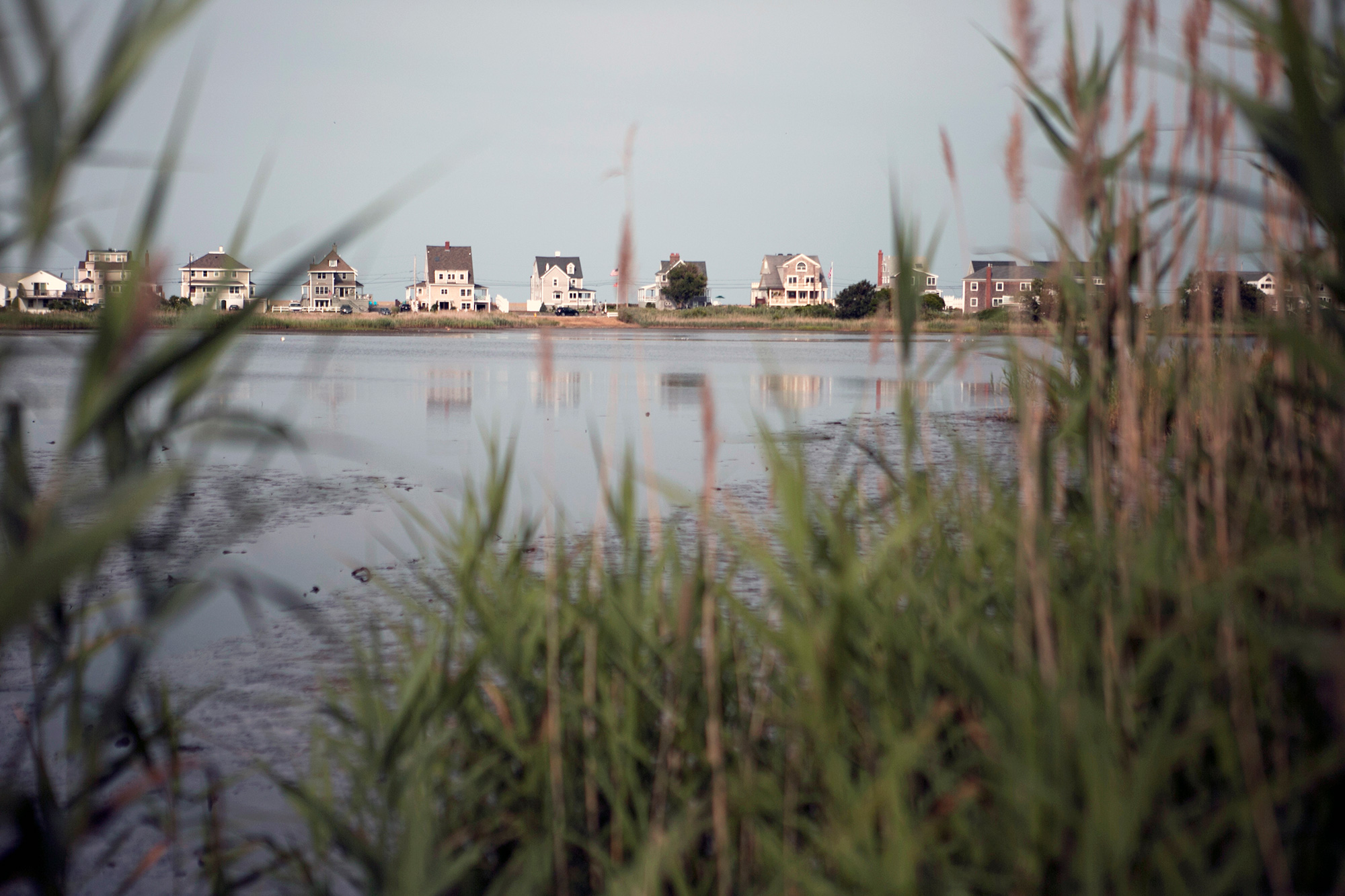 Scituate homes are being raised 16 to 20 feet above sea level to comply with the ‘100-year-storm flood marker,’ a level that fluctuates depending on location. The town offers select grants to homeowners to adapt their homes for flooding through the Federal Hazard Mitigation Grant Program. Financial assistance can provide up to 75 percent of the total cost of the climate mitigation project. (Photo by Lauren Owens Lambert/GroundTruth)