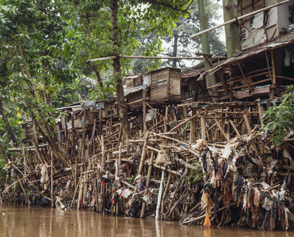 Homes line the bank of the Ciliwung River in Jakarta. (Photo by Muhammad Fadli)