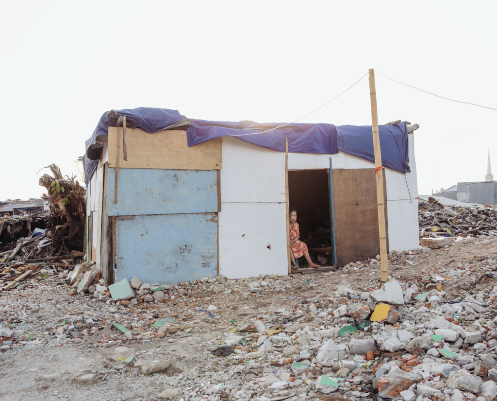 Like many other Pasar Ikan residents who saw their houses razed, Ayuti is now living in a makeshift house built on the rubble. She has yet to receive any compensation. (Photo by Muhammad Fadli)