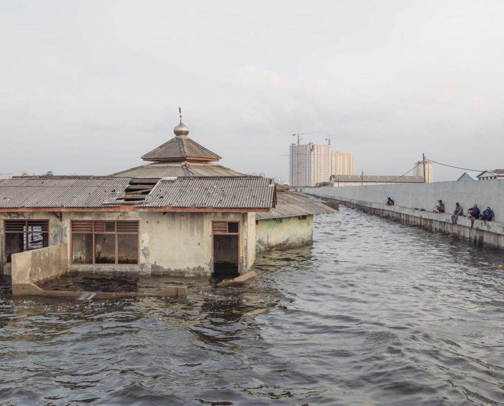 An abandoned mosque outside the sea wall in Muara Baru, North Jakarta. Jakarta is sinking as a result of massive groundwater extraction. And Muara Baru, one of the fastest sinking parts of the city, is already located below the sea level. (Photo by Muhammad Fadli)