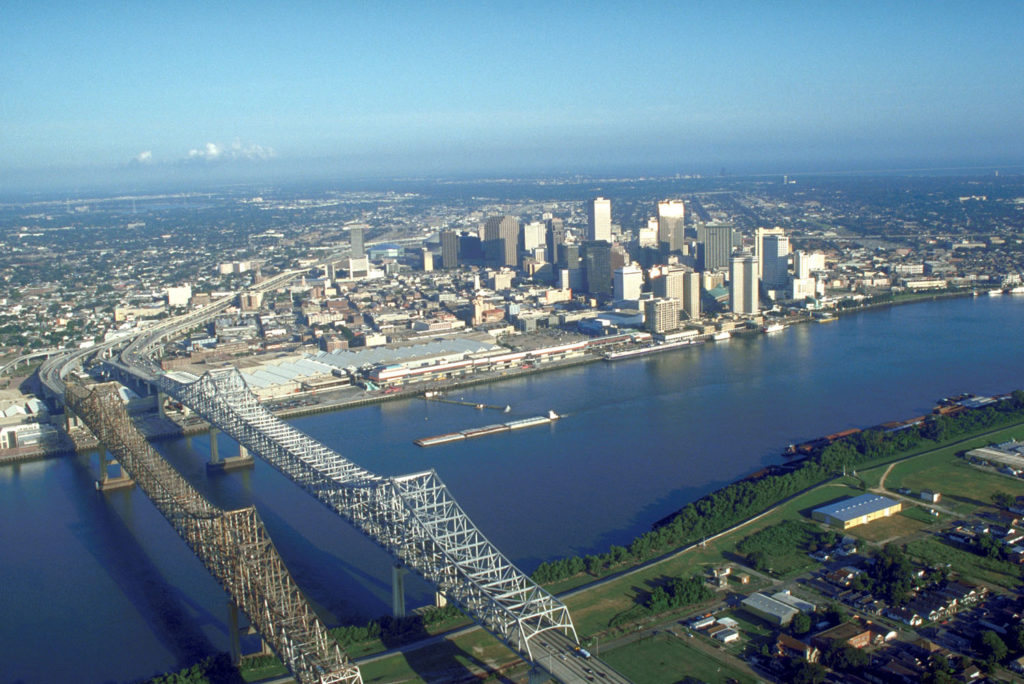 New Orleans is sinking and therefore vulnerable to flooding and storm surges.