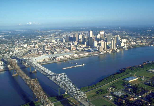 New Orleans is sinking and therefore vulnerable to flooding and storm surges.