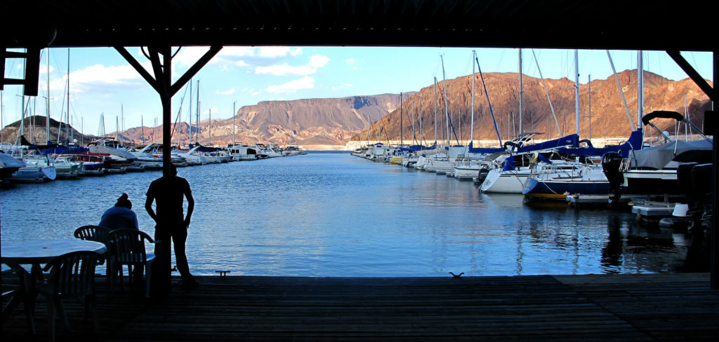 A man looks out on the Marina in Lake Mead, Nevada. (Photo by Charlotte Weiner/GroundTruth)