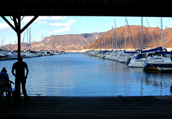 A man looks out on the Marina in Lake Mead, Nevada. (Photo by Charlotte Weiner/GroundTruth)