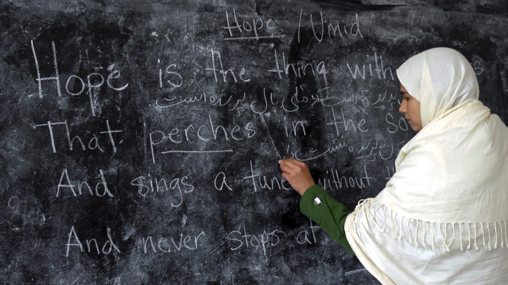 A student writes on the blackboard at the Zabuli School in Deh-Subz, Afghanistan. (Beth Murphy/GroundTruth Films)