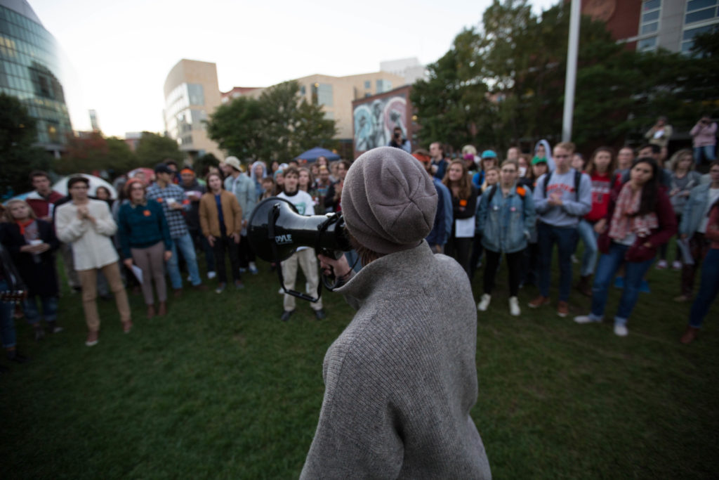 Surrounded by a crowd, a Northeastern University student advocated for divestment from fossil fuels on campus on the evening of Tuesday, Oct. 4, 2015. (Photo by Alastair Pike/GroundTruth)