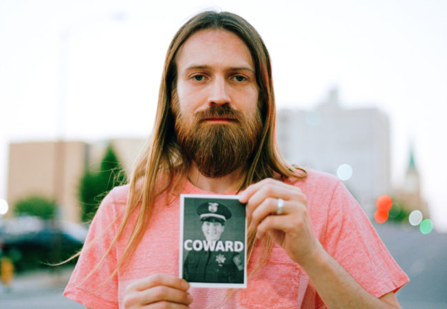 Zach Miller, 33, protests police in Tulsa, Oklahoma. (Photo by Edwin Torres/GroundTruth)