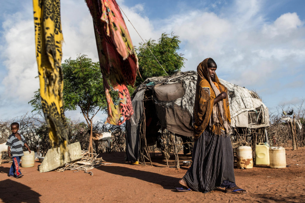 A woman walks through her family's compound in Dadaab refugee camp. (Photo by Nichole Sobecki/GroundTruth)
