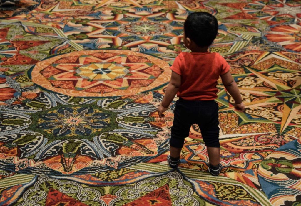While childcare costs are demanding more and more of parents' wallets, the mean salary of U.S. daycare workers has grown by just 1 percent in the last decade, according to a study by UC Berkeley. (Photo by Alicia Miles/GroundTruth)