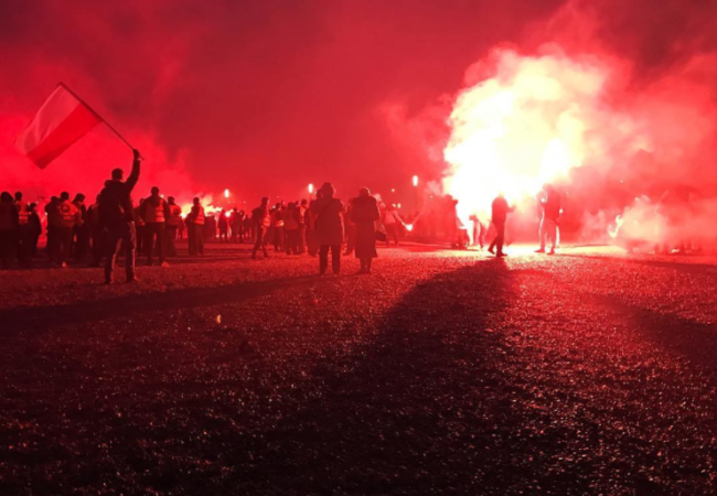 Young people participate in a nationalist demonstration on the country's Independence Day in Warsaw, Poland. (Photo by Karolina Chorvath/GroundTruth)