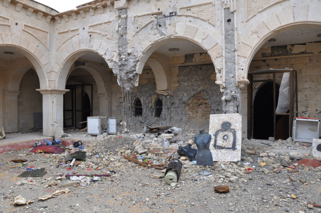 The destroyed courtyard of Qaraqoosh's Al-Taheera church, the largest in Iraq and one of the biggest in the Middle East. ISIS transformed the grounds into a shooting range with mannequins from a nearby clothing shop. (Photo by Lauren Bohn/GroundTruth)