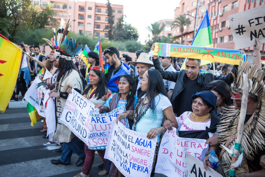 People participate in a climate march in Marrakech during the U.N. climate conference, COP22. (Photo by David Tong/Flickr)