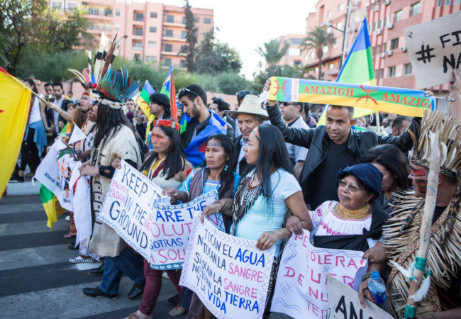 People participate in a climate march in Marrakech during the U.N. climate conference, COP22. (Photo by David Tong/Flickr)