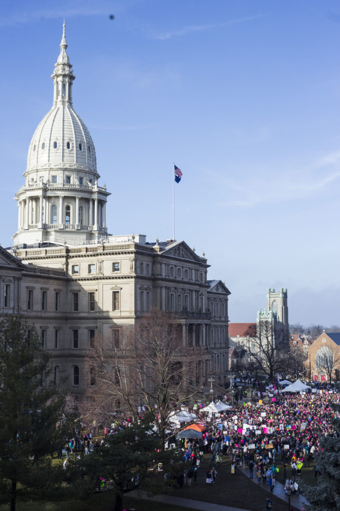 Thousands gather outside of the Michigan State Capitol Building for the Women's March on Lansing in Lansing, Mich., on Saturday, January 21, 2017. (Photo by Brittany Greeson/GroundTruth)