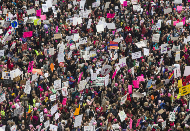 Thousands gather outside of the Michigan State Capitol Building for the Women's March on Lansing in Lansing, Mich., on Saturday, January 21, 2017. (Photo by Brittany Greeson/GroundTruth)
