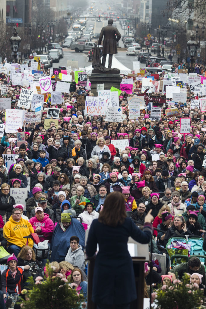 Michigan gubernatorial candidate Gretchen Whitmer speaks to a crowd of thousands outside of the Michigan State Capitol Building for the Women's March on Lansing in Lansing, Mich., on Saturday, January 21, 2017. (Photo by Brittany Greeson/GroundTruth)