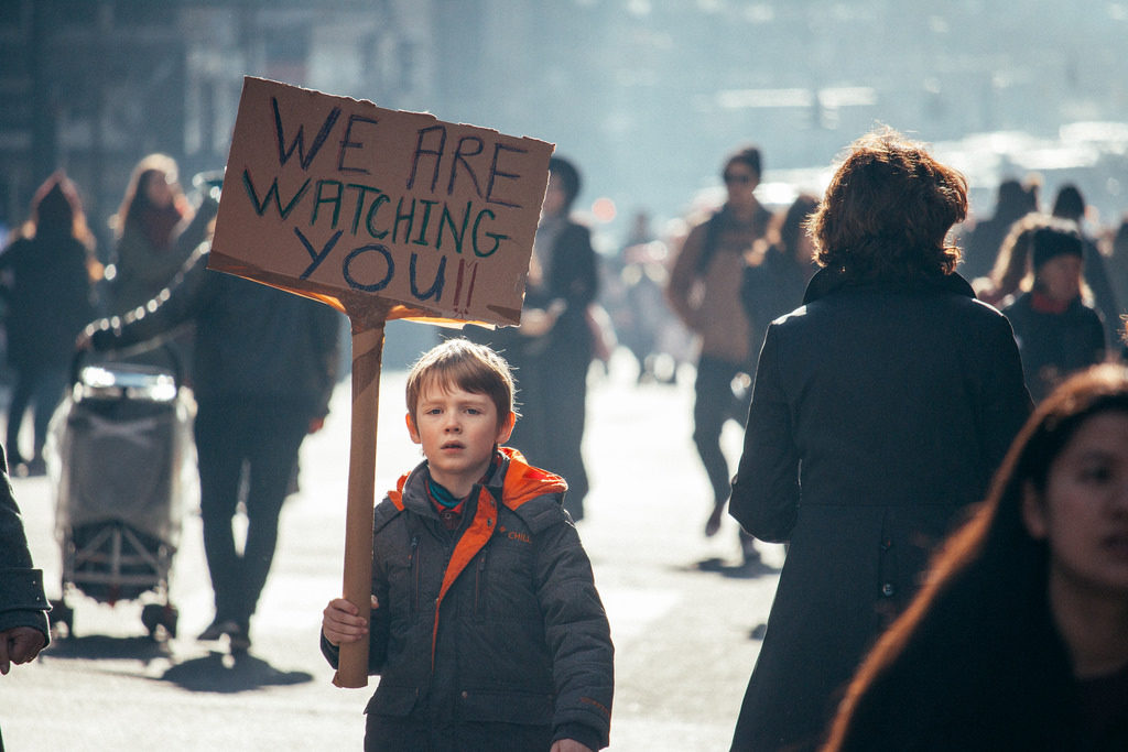 A young boy carries a sign addressed to President Donald Trump at a Women's March in New York City on Jan. 21, 2017.