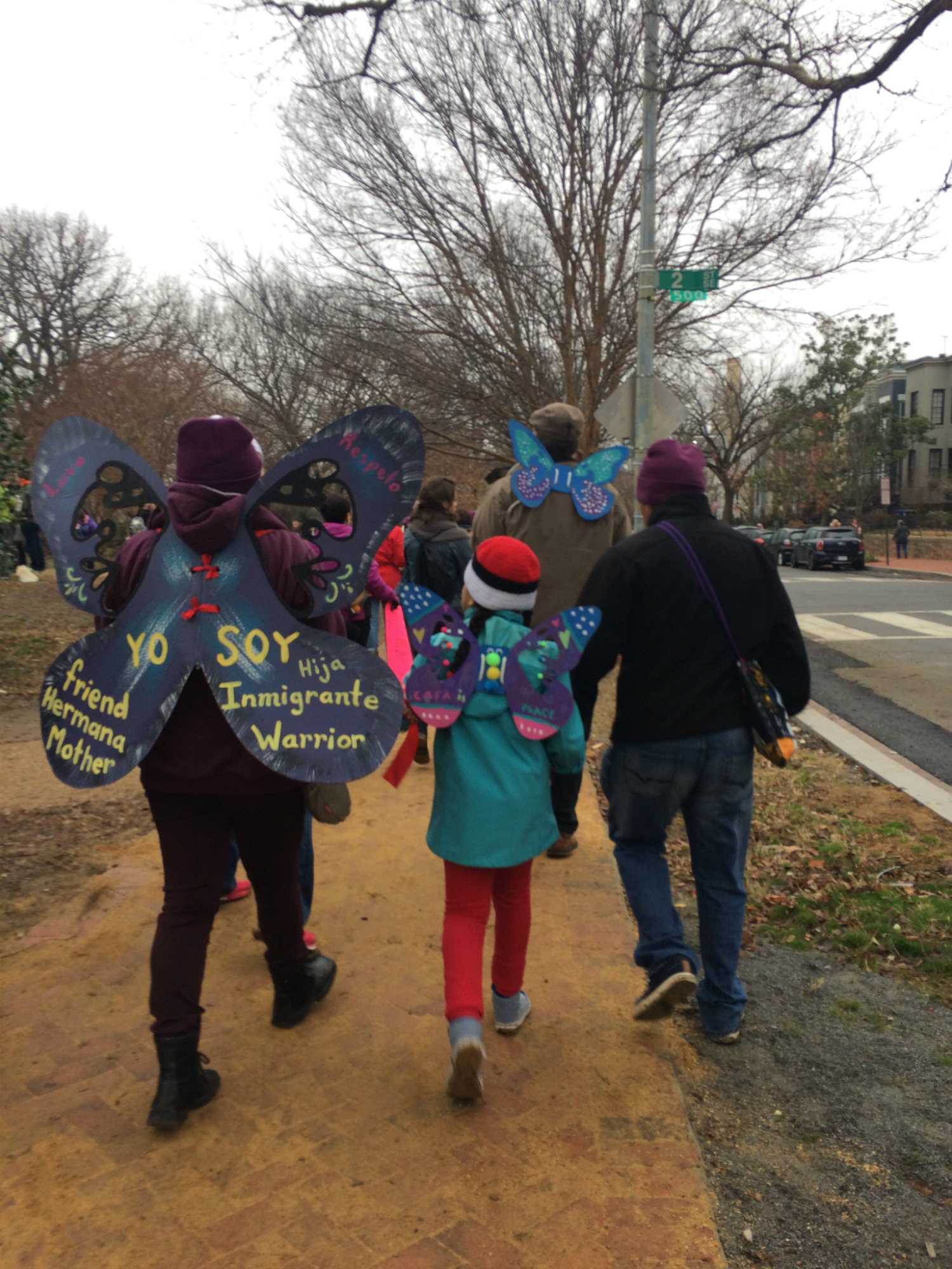 Mother and daughter wore hand-painted butterfly wing as a symbol of migration. (Photo by Giulia Afiune/GroundTruth)