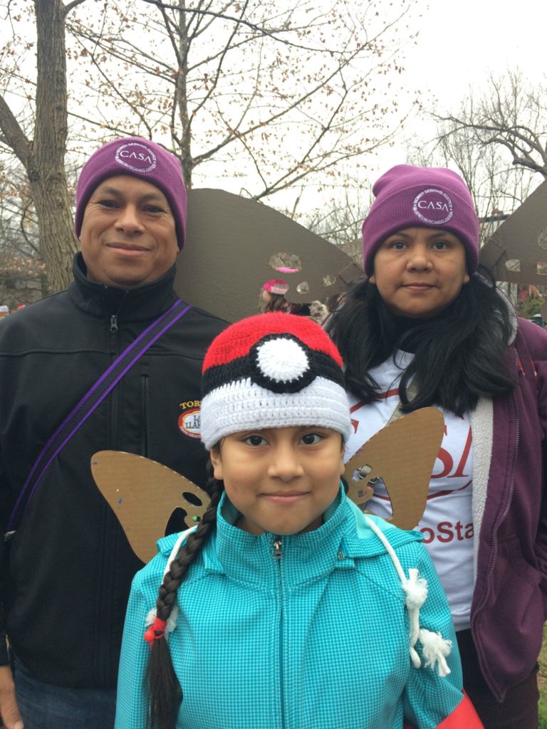 Madai Ledezma (right), was part of the Women's March on Washinton, D.C. with her husband and daughter: I want to teach her how to fight. (Photo by Giulia Afiune/GroundTruth) 