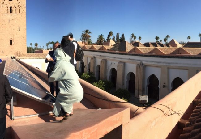 Marrakech’s Koutoubia mosque has soaked up the Moroccan sun for nearly 900 years. Now it also puts those rays to work generating clean electricity. (Photo by Chris Bentley/GroundTruth)