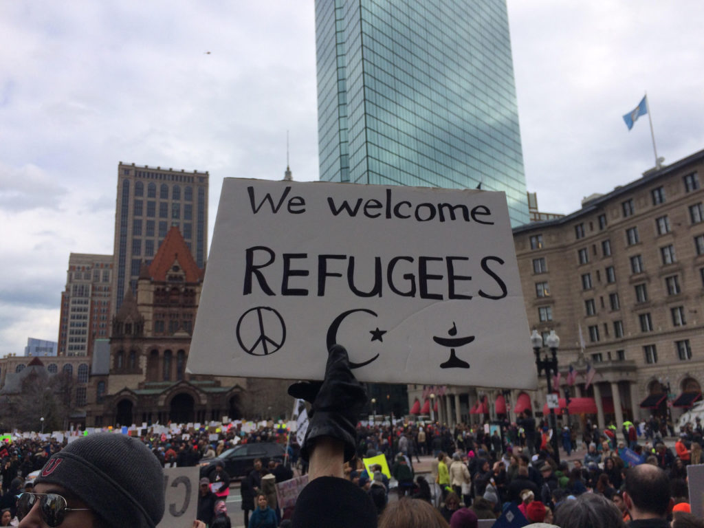 A sign reads "We welcome refugees" at a demonstration in Boston's Copley Square on January 29, 2017. (Photo by Giulia Afiune/GroundTruth)