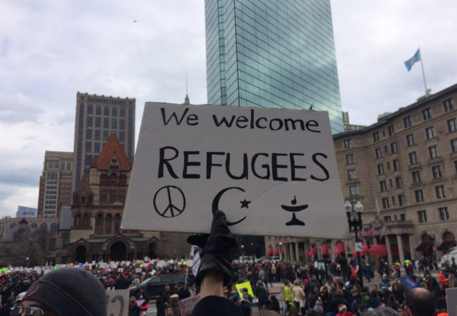 A sign reads "We welcome refugees" at a demonstration in Boston's Copley Square on January 29, 2017. (Photo by Giulia Afiune/GroundTruth)