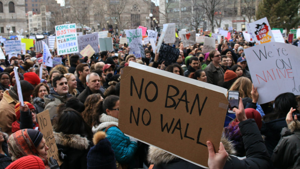 The debate on immigration has become extremely polarized. How do you write stories that say something new? Find people who've never been asked about their experiences. Pictured: protesters in Boston's Copley Square on Jan. 29, 2017, after President Donald Trump signed an executive order known as the "Muslim ban." (Photo by Giulia Afiune/GroundTruth)