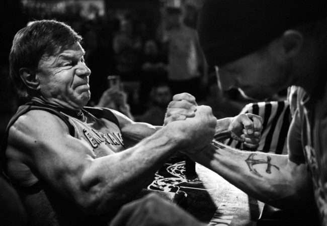 2) Devio pins an opponent in the 2nd round of the Maine State Championship arm wrestling tournament in South Portland, Maine, on March 12, 2016.(Photo by Adam Glanzman/GroundTruth).