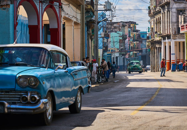 People walk along a streets in Havana, Cuba. Diplomatic relations between Cuba and the United States were re-established during Barack Obama's presidency – but now, with Donald Trump in office, the future of these diplomatic relations are somewhat unclear. (Photo by Pedro Szekely/Flickr)