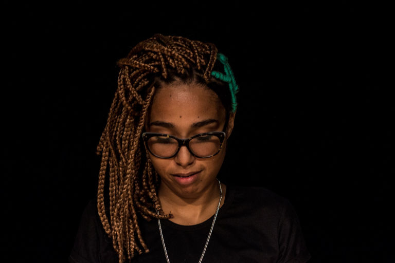 Brazil rapper Yas Werneck, whose music includes themes of female friendship and solidarity, prepares for a show in Rio's northern periphery that was publicized by Black Power Girls member Suzane Santos. (Photo by Leonardo Coelho/GroundTruth)