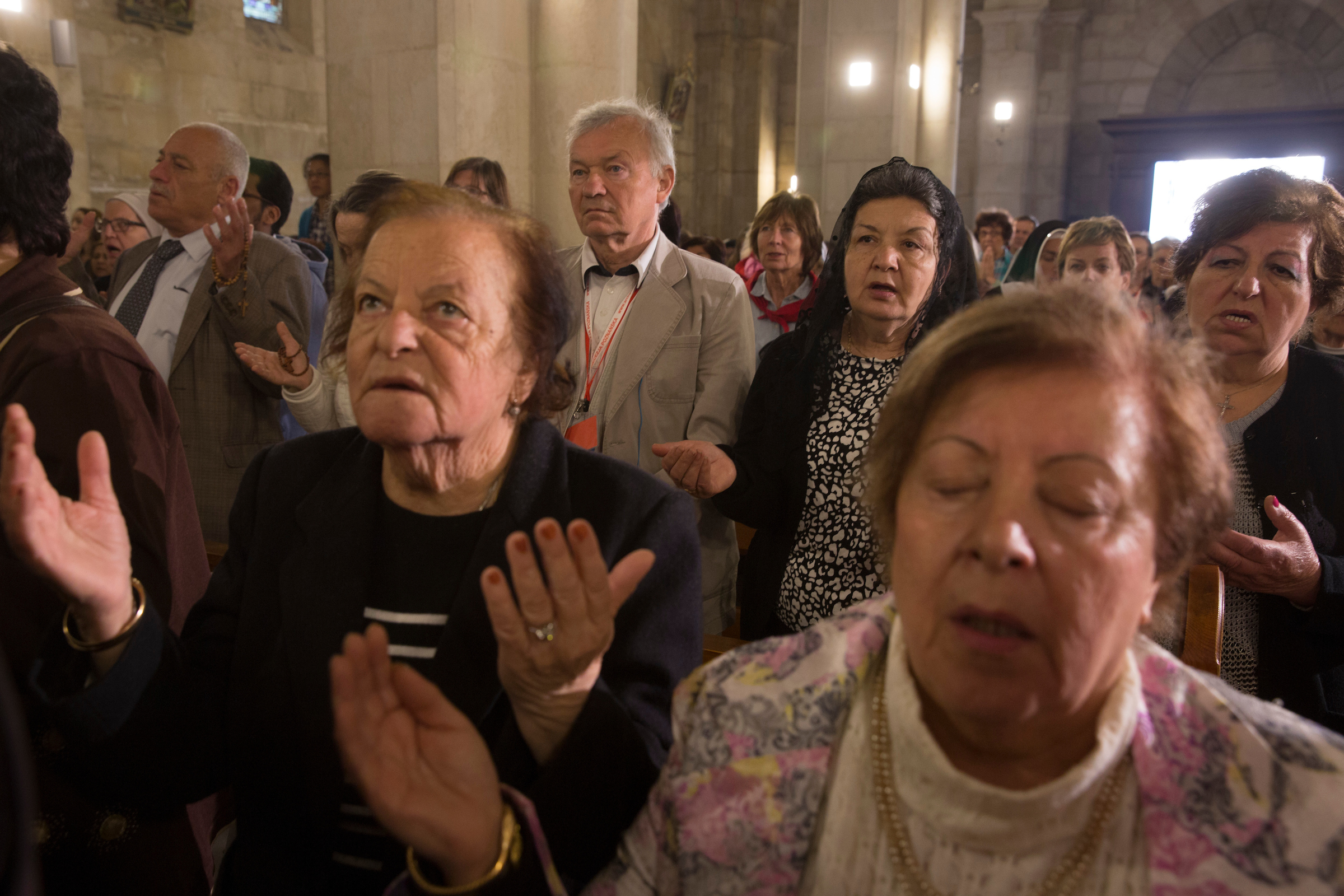 Palestinian Christians worship at the Franciscan Church of Emmaus during a Mass that celebrates the biblical story of The Road to Emmaus, in the West Bank village of El Qubeibeh on Monday, April 17, 2017. (Photo by Heidi Levine/The GroundTruth Project)