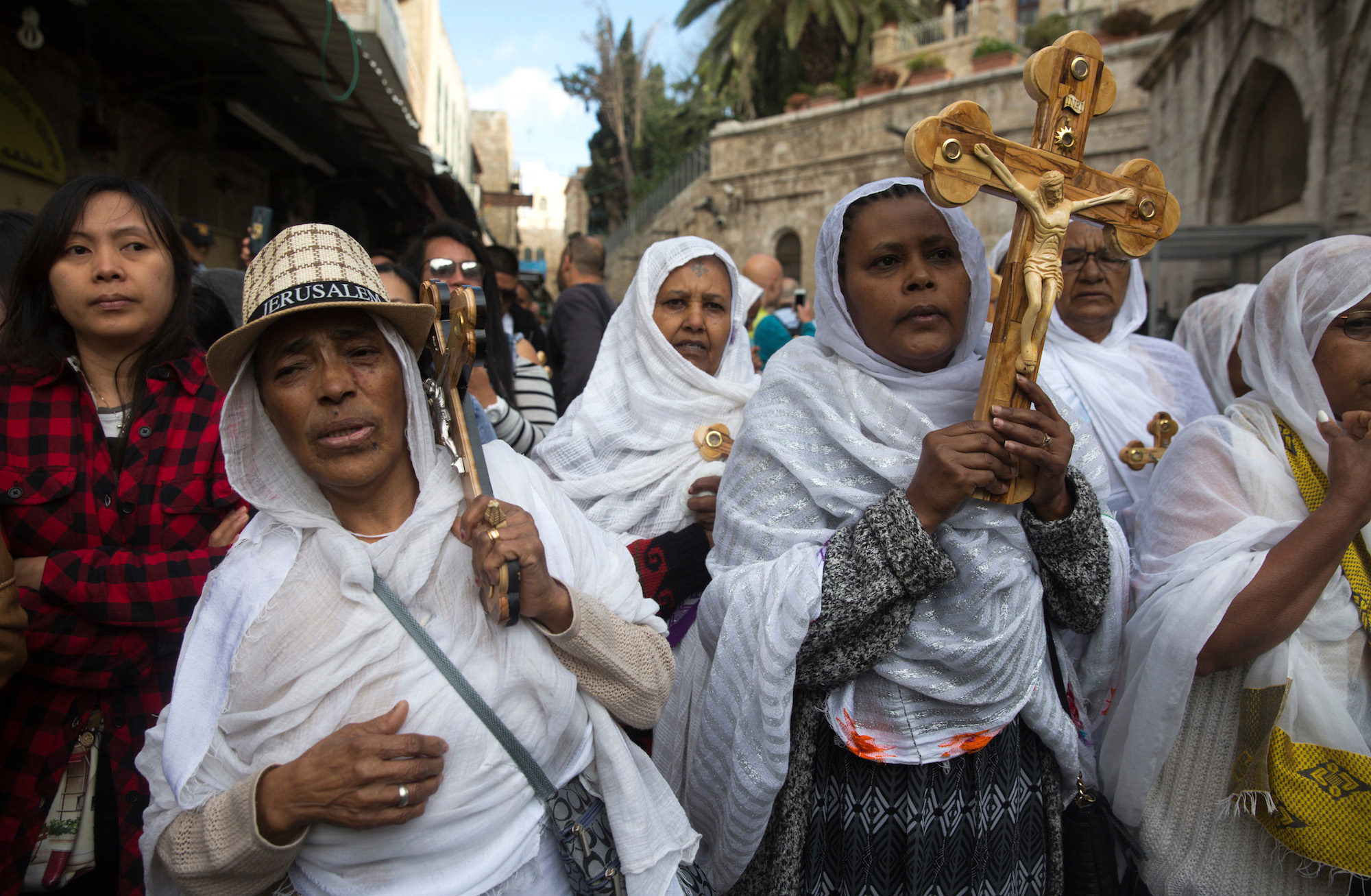 Christian pilgrims from Eritrea are seen amongst the thousands of pilgrims from all over the world who carried wooden crosses along the Via Dolorosa, or “The Way of Sorrow" in the Old City of Jerusalem on April 14, 2017. The Good Friday procession remembers the day Jesus was sentenced to death and crucified. Christian faith holds that two days later, on Easter Sunday, Jesus rose from the dead. (Photo by Heidi Levine/GroundTruth)