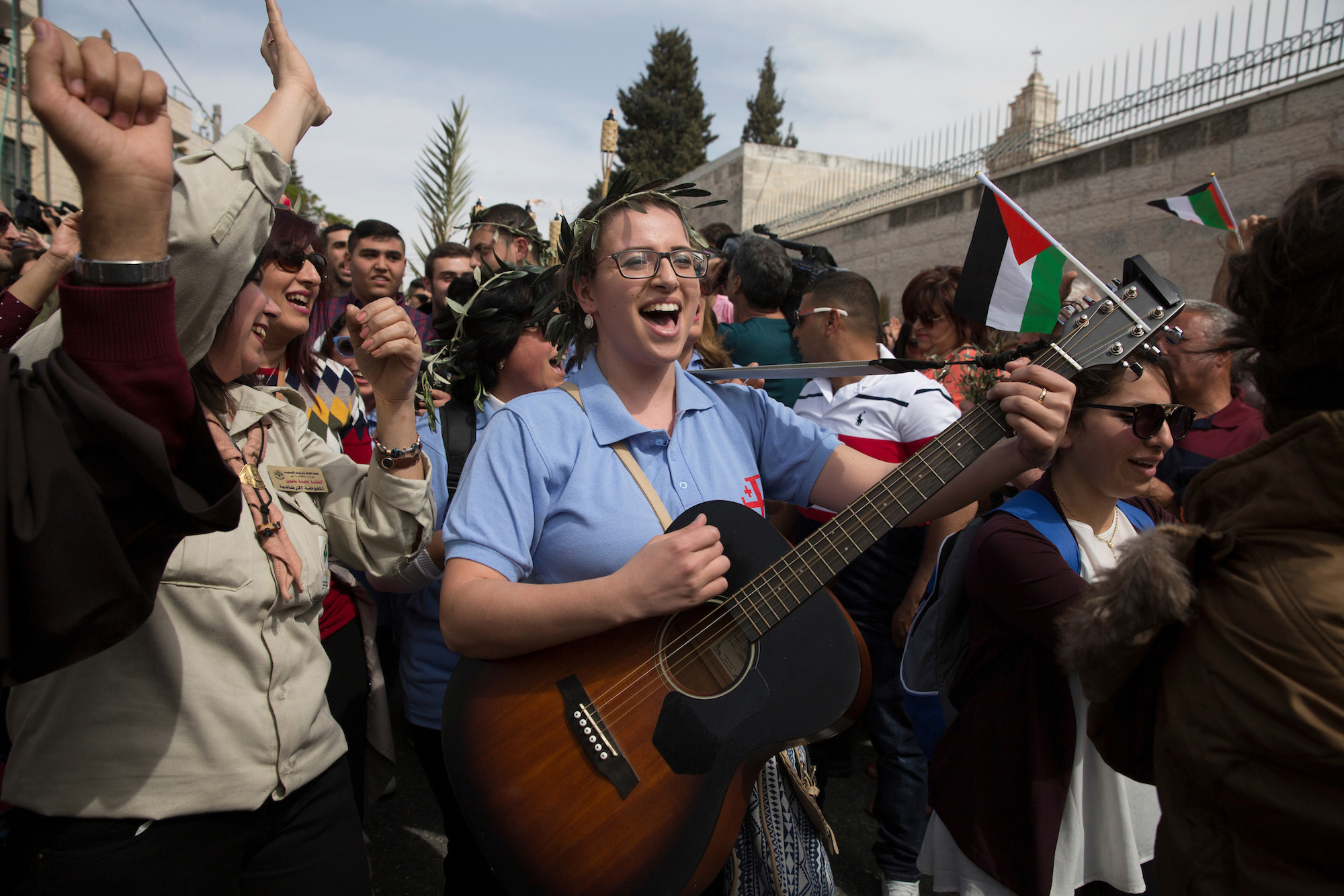 Palestinian Christian Pilgrims from Beit Jala celebrate during a Palm Sunday procession on the Mt. of Olives on April 9, 2017. (Photo by Heidi Levine/Sipa Press).